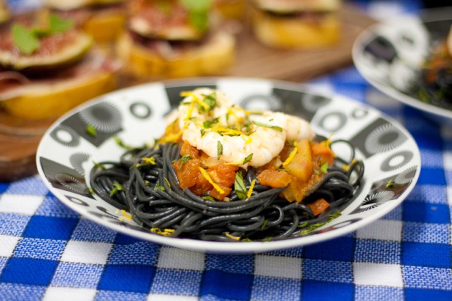 spaghetti al nero di seppia with tomatoes and shrimp sauce